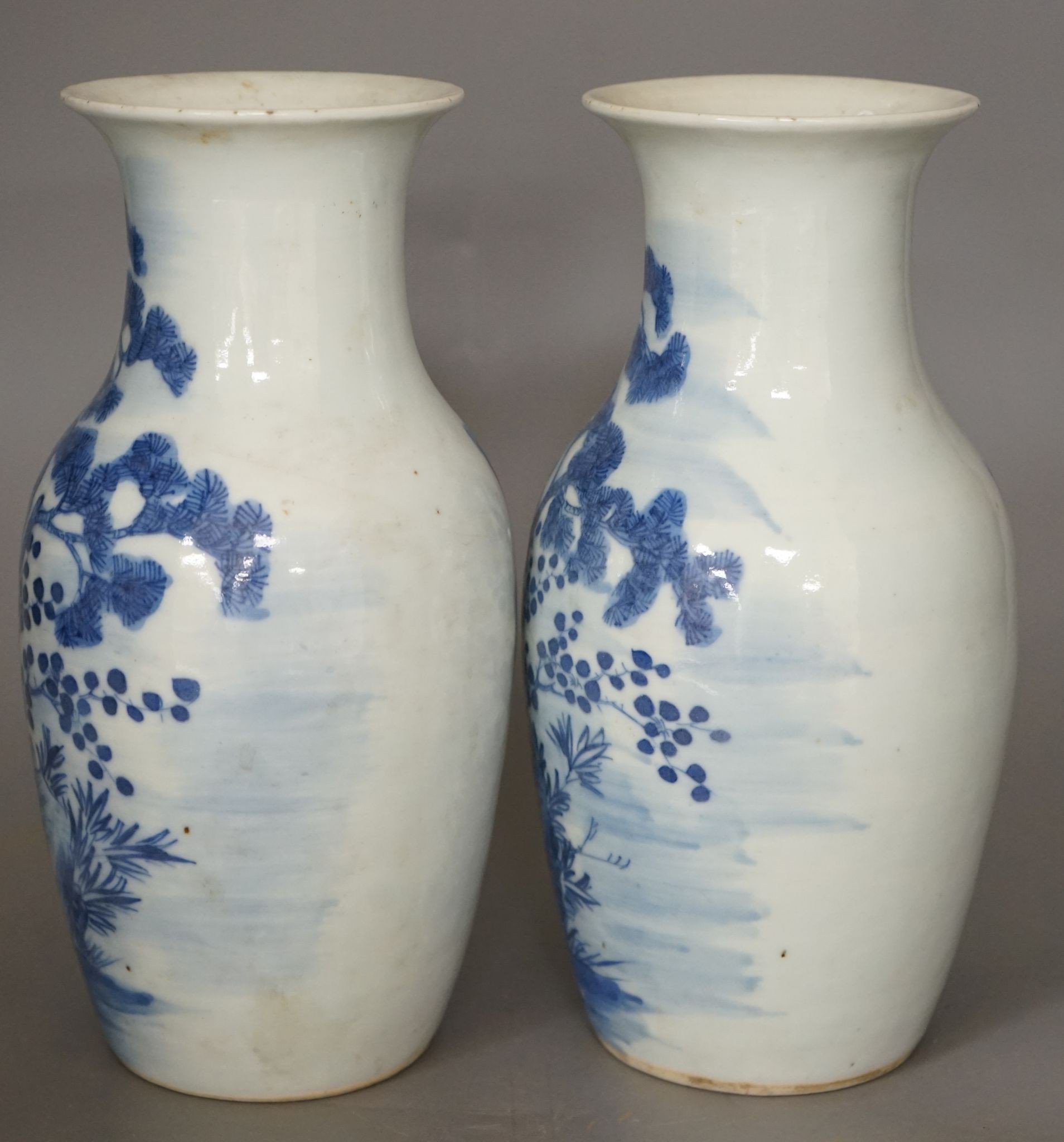 A pair of 19th century Chinese blue and white three friends of winter vases 22cm